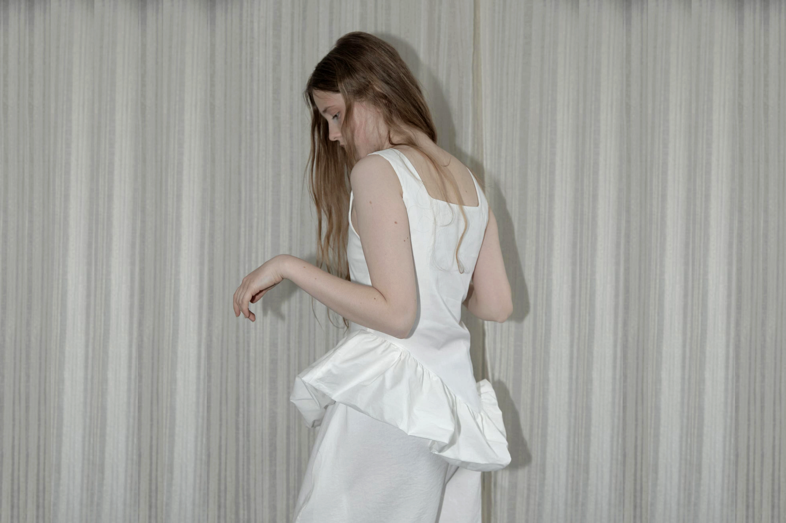 White ruffle hem editorial — Korean fashion for European buyers